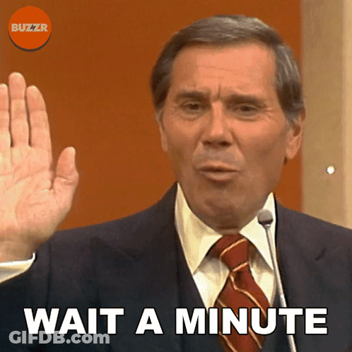 Man In Suit Saying Wait A Minute GIF