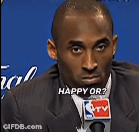 Man In Suit Saying What's Into Microphone GIF