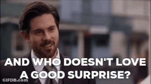 Man In Suit Saying Who Doesn't Love A Good Surprise GIF