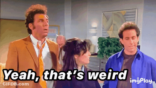 Man In Suit Saying Yeah That's Weird Next To Two Men GIF