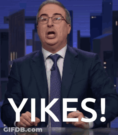 Man In Suit Saying Yikes In Front Of City Skyline GIF