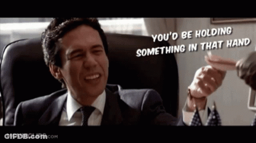 Man In Suit Saying You'd Be Holding Something GIF