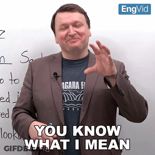 Man In Suit Saying You Know What I Mean In Front Of Whiteboard GIF