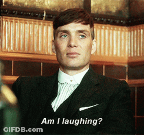 Man In Suit Says Am I Laughing GIF