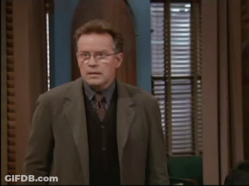Man In Suit Says Calm Yourself Little One GIF