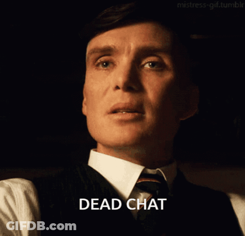 Man In Suit Says Dead Chat In Dark Room GIF