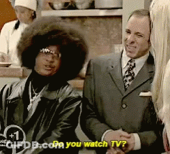 Man In Suit Says Do You Watch TV Next To Woman GIF