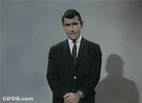 Man In Suit Says Fortune Favors The Bold Stay Tuned A Strange Experience Ami GIF