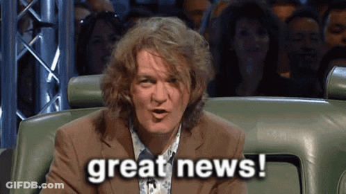 Man In Suit Says Great News To Crowd GIF