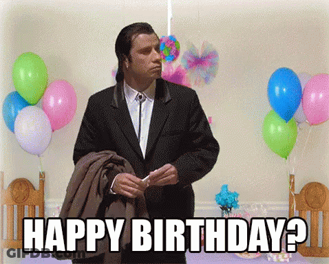 Man In Suit Says Happy Birthday In Front Of Balloons GIF