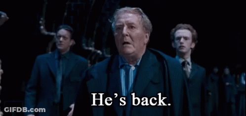 Man In Suit Says He's Back To Men GIF