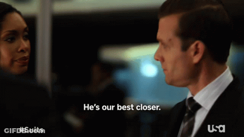Man In Suit Says He's Our Best Closer In Front Of Woman GIF