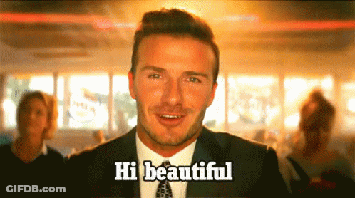 Man In Suit Says Hi Beautiful To Group GIF