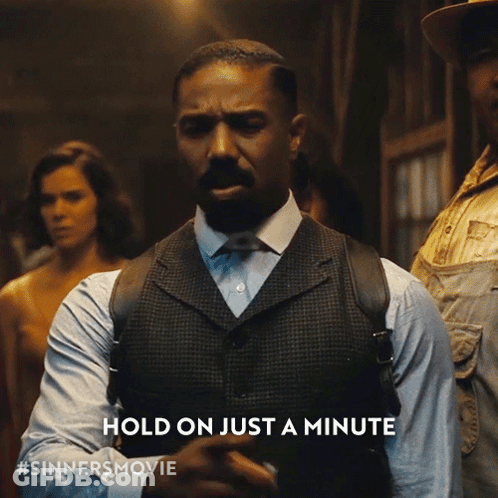 Man In Suit Says Hold On Just A Minute GIF