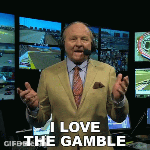 Man In Suit Says I Love The Gamble In Front Of Monitors GIF