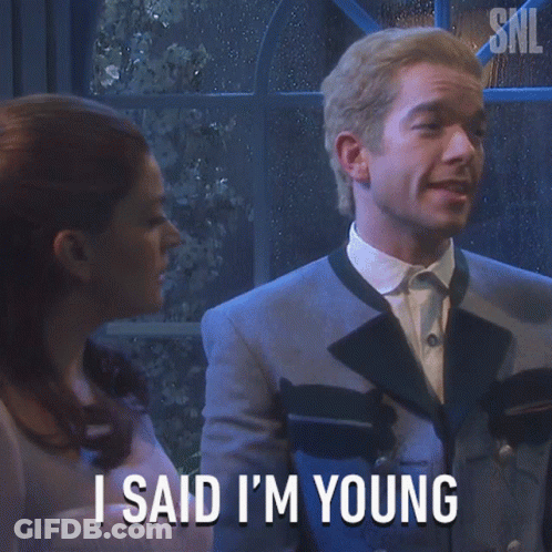 Man In Suit Says I Said I'm Young In Front Of Woman GIF