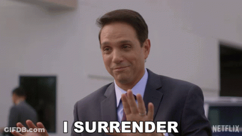 Man In Suit Says I Surrender In Front Of Netflix Logo GIF