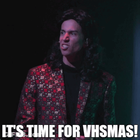 Man In Suit Says It's Time For VHSmas GIF