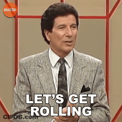 Man In Suit Says Let's Get Rolling GIF