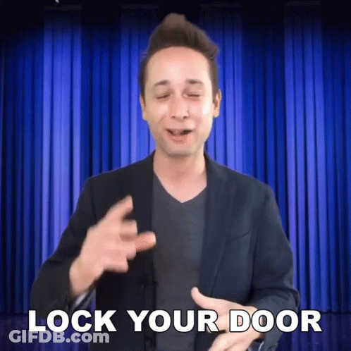 Man In Suit Says Lock Your Door GIF