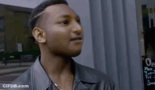 Man In Suit Says No It's Not Me In Front Of Car GIF