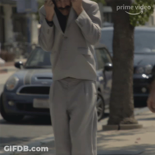 Man In Suit Says No Its Not Me In Front Of Car GIF