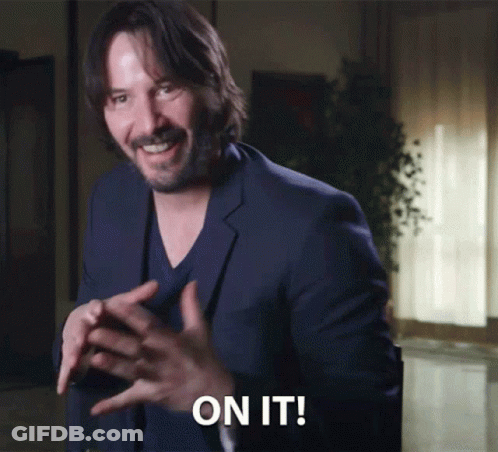 Man In Suit Says On It In Dark Room GIF