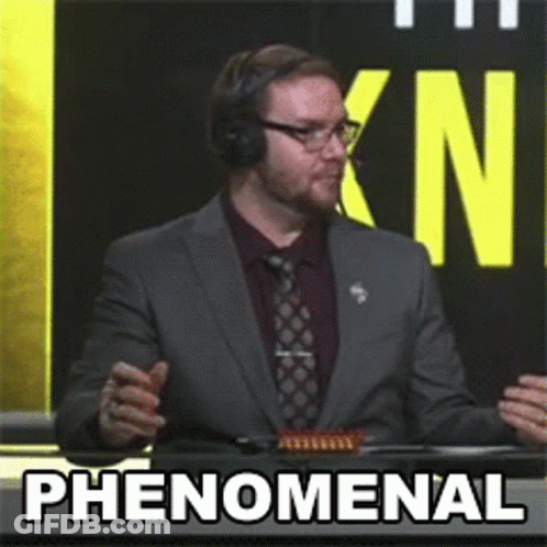 Man In Suit Says Phenomenal In Front Of KN Sign GIF
