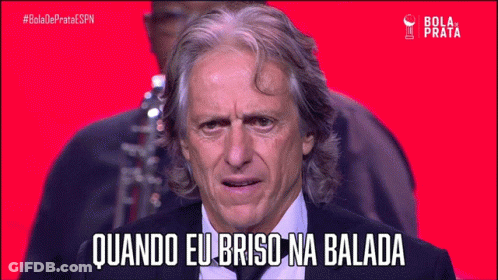 Man In Suit Says Quando Eu Brisa Na Balada On Red Background GIF