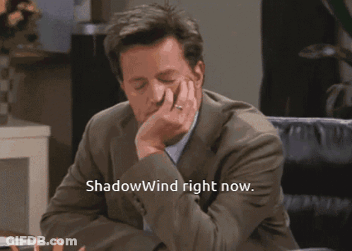 Man In Suit Says Shadowwind Right Now With Hand On Chin GIF