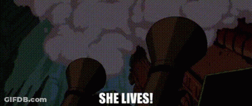 Man In Suit Says She's Alive Red Letters GIF