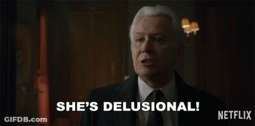 Man In Suit Says She's Delusional GIF
