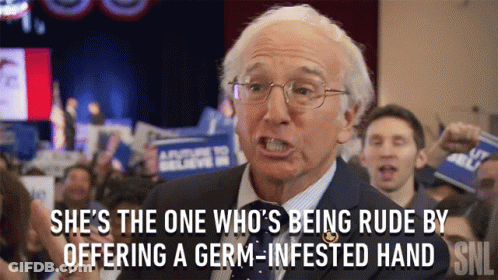 Man In Suit Says She's The One Being Rude By Offering A Germ GIF