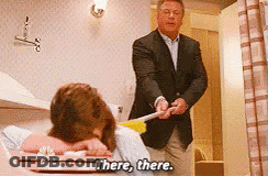 Man In Suit Says There There To Woman In Bathtub GIF