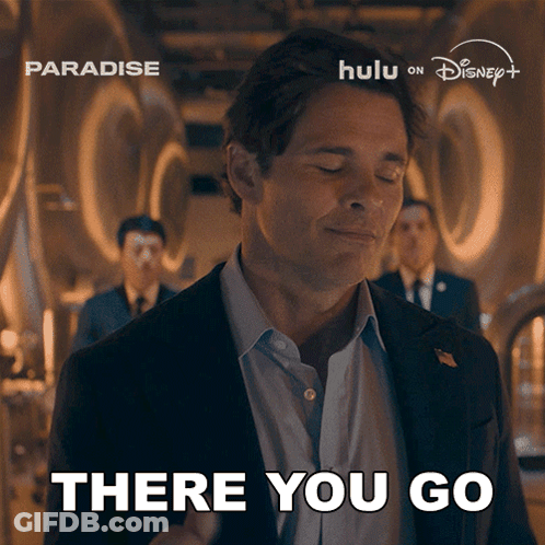 Man In Suit Says There You Go At Paradise Ad GIF