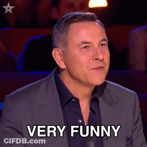 Man In Suit Says Very Funny In Front Of Star GIF