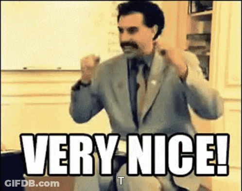 Man In Suit Says Very Nice GIF