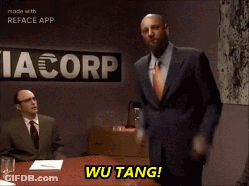 Man In Suit Says Wu Tang Via Corp Sign GIF
