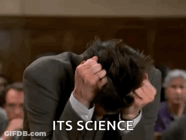 Man In Suit Scratching Head In Courtroom GIF