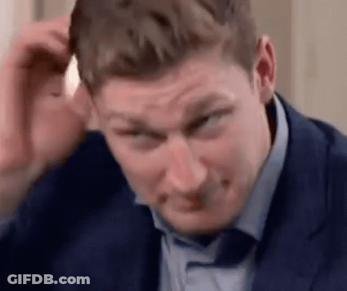Man In Suit Scratching Head GIF