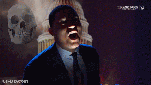 Man In Suit Screaming In Front Of Skull And Daily Show Logo GIF