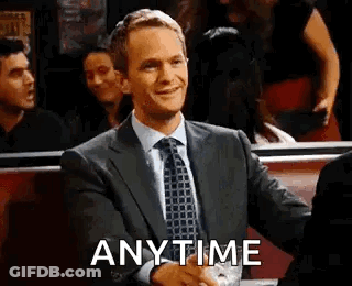 Man In Suit Shaking Hands With Another In Diner GIF