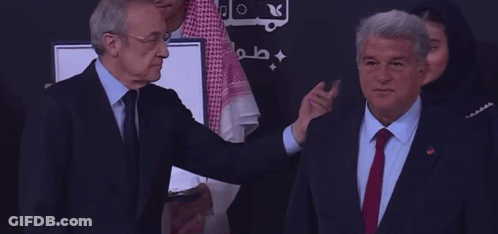 Man In Suit Shaking Hands With Man In Keffiyeh GIF