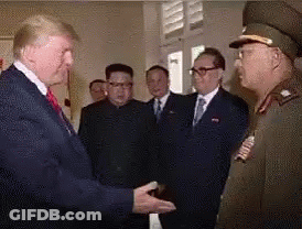 Man In Suit Shaking Hands With Military Officer GIF