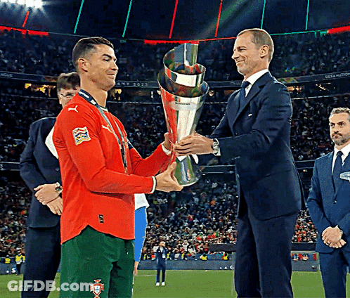 Man In Suit Shaking Hands With Soccer Player GIF