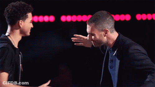 Man In Suit Shaking Hands With Young Man GIF