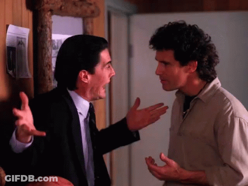 Man In Suit Shouting At Tan Shirt GIF