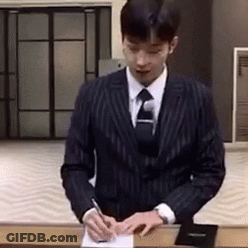 Man In Suit Signing Paper With Pen GIF