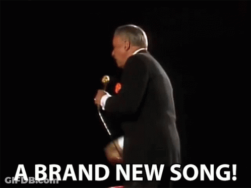Man In Suit Singing 'A Brand New Song GIF