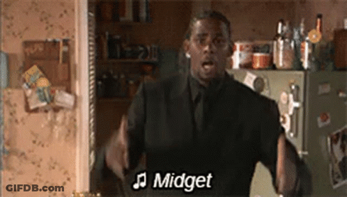 Man In Suit Singing In Front Of Refrigerator GIF